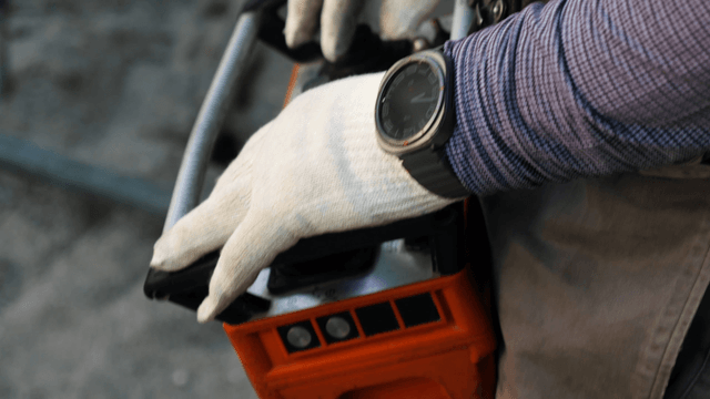 Worker operating machinery with precision