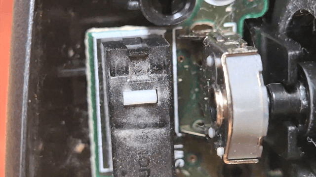 Close-up of dusty mouse electronic circuit components