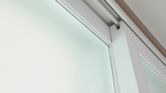 Close-up of a frosted glass window indoors