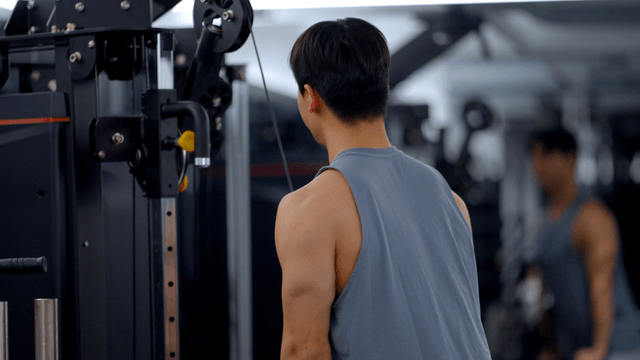 Man exercising in a gym with equipment