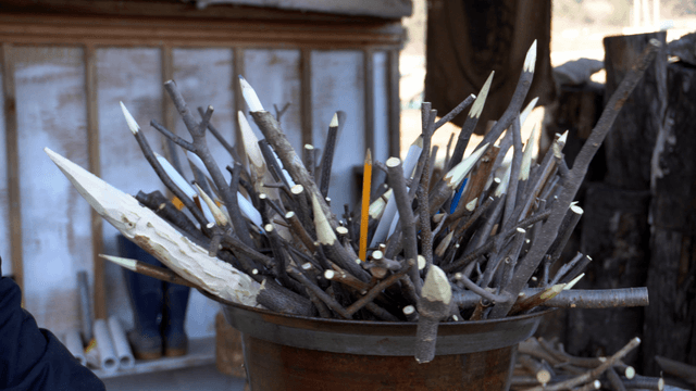 Collection of carved wooden pencil sticks for crafts