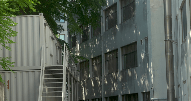 Quiet alley with a metal staircase