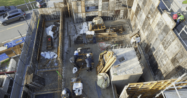 Construction site with workers and materials