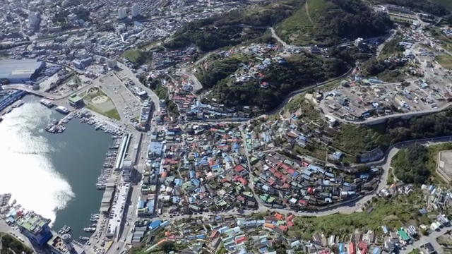 A coastal village with a bustling harbor