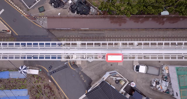 Aerial view of a train passing through a city