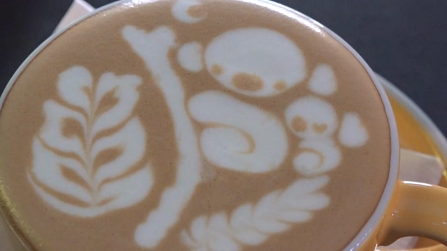 Intricate latte art on a cup of coffee