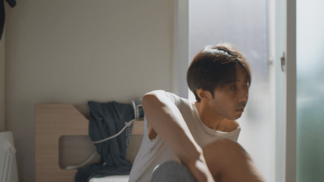 Man sitting in a room with sunlight