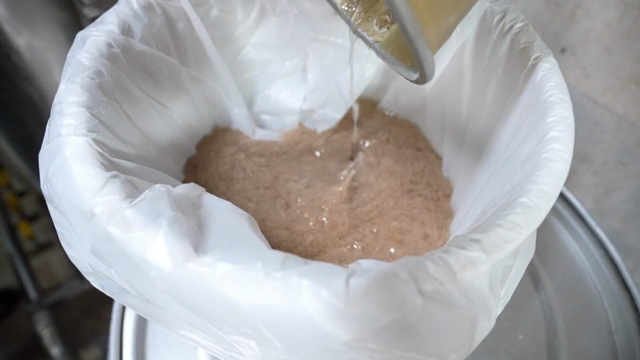 Pouring boiled broth into a container