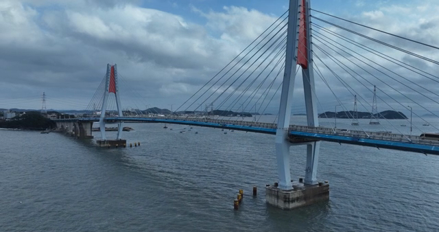 A modern bridge over a calm sea