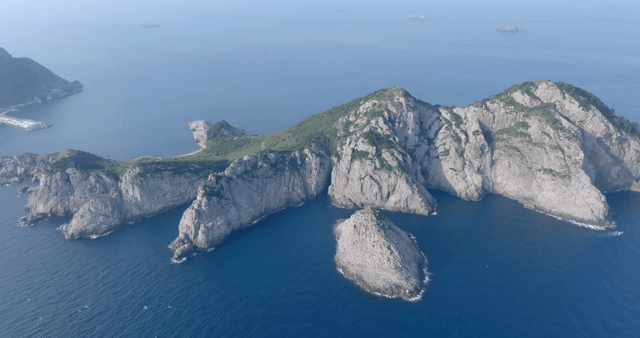 Aerial view of a rocky island in the sea
