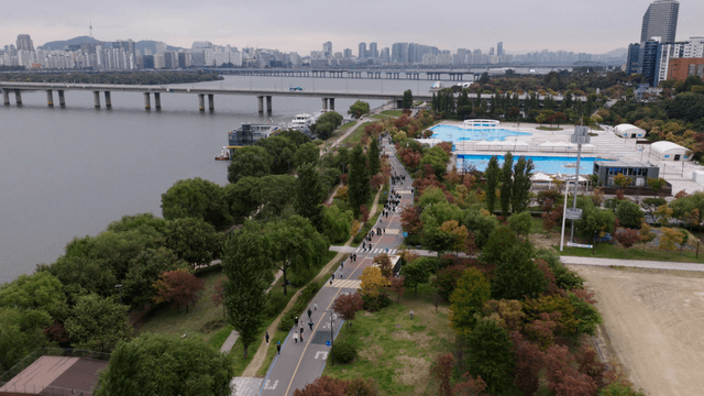 Autumn scenery along riverside walkway