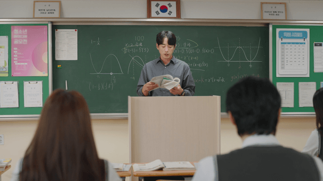 Teacher explaining math in a classroom