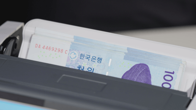 Korean banknotes in a counting machine