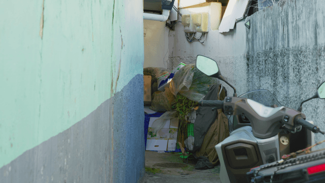 Narrow alley with a parked scooter
