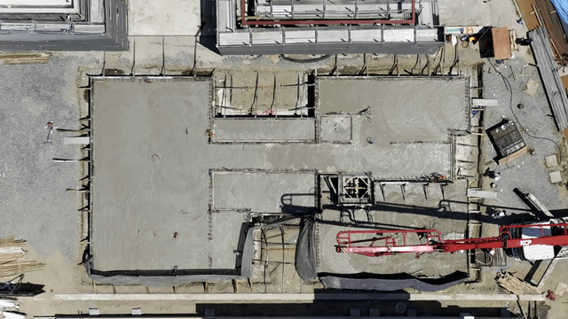 Construction site with workers and machinery