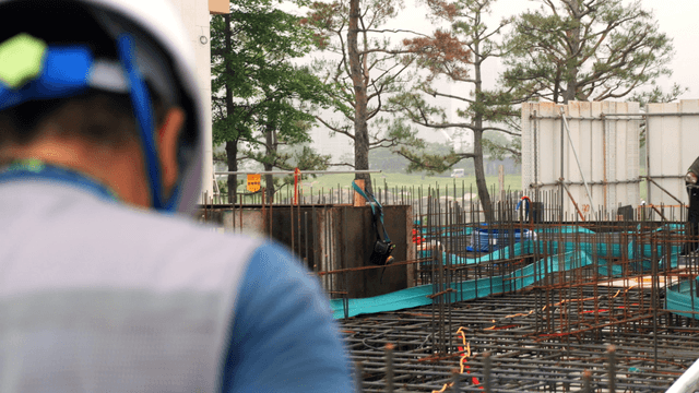 Construction site with workers and equipment
