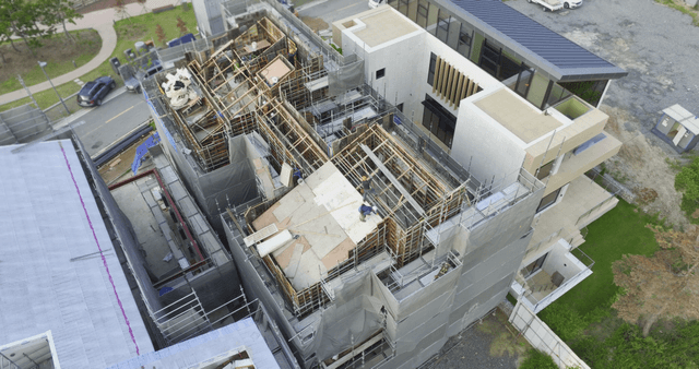 Construction site with workers and scaffolding