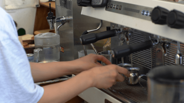 Barista organizing an espresso machine