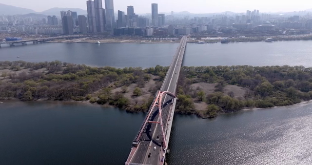 A bridge connecting a city over a river
