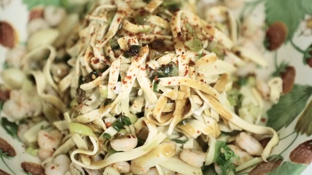 A dish of noodles with shrimp and spices