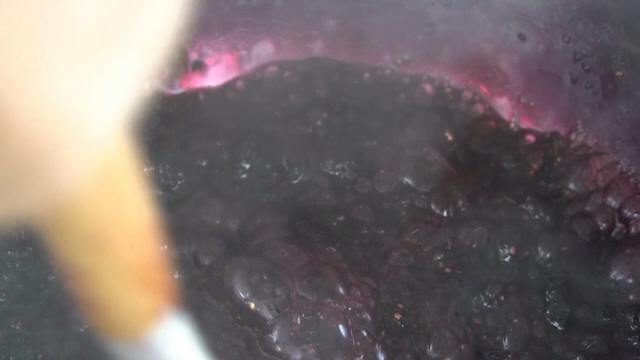 Mulberries simmering in a pot