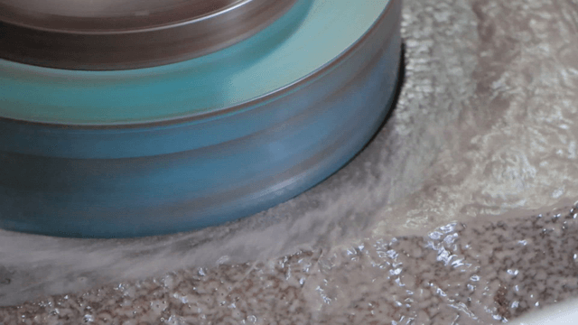 Grinder on basalt with shallow cooling water