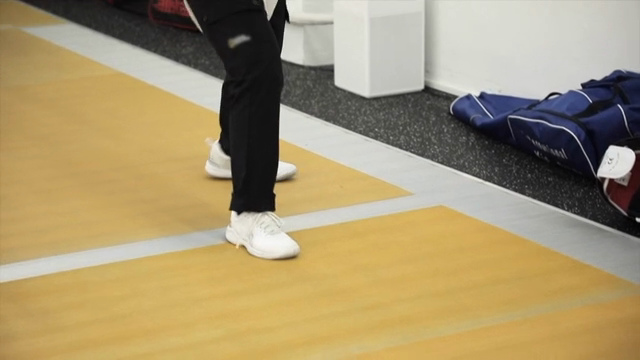 Indoor fencing practice with footwork
