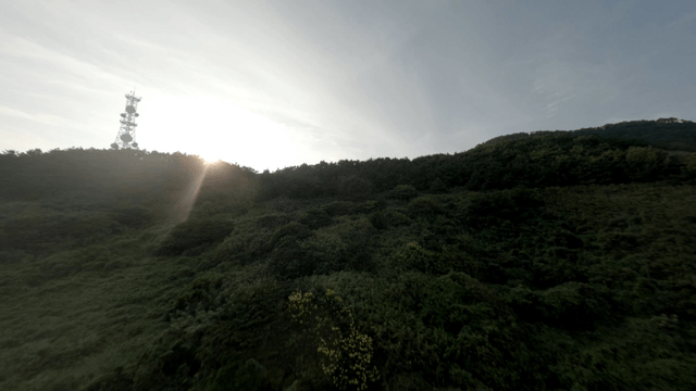 A serene village with mountains at sunrise