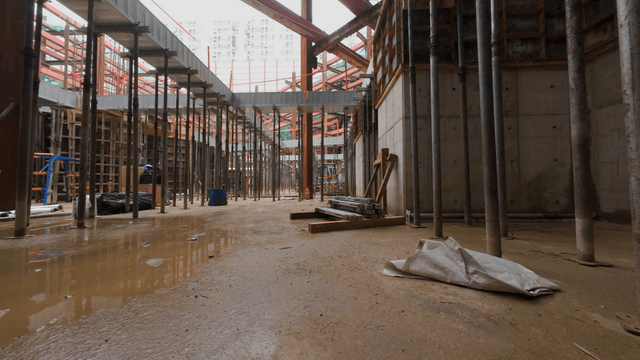 Construction site with metal beams and scaffolding