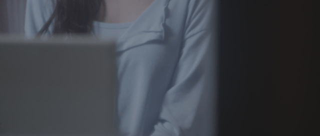 Woman smiling while streaming online
