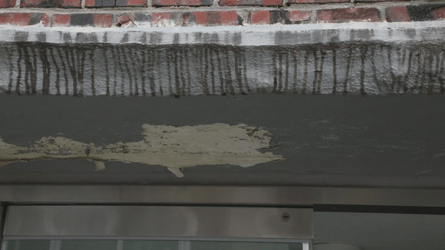 Peeling paint on a building facade