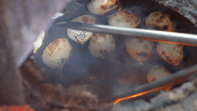 Fire oven dumplings taken out from a traditional oven