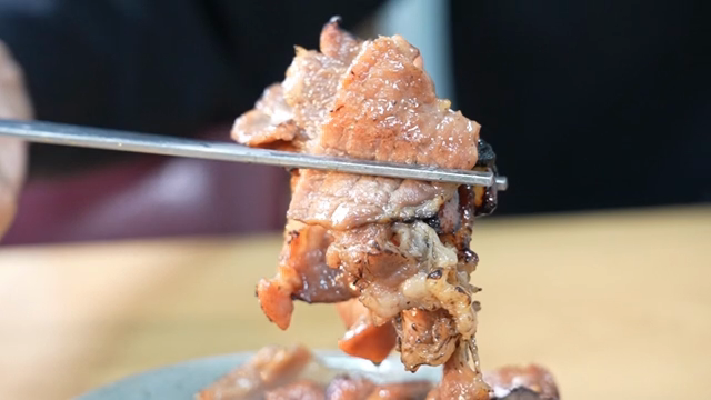 Grilled pork belly in a bowl