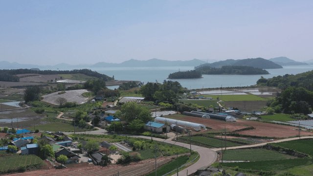 Rural landscape with fields and sea