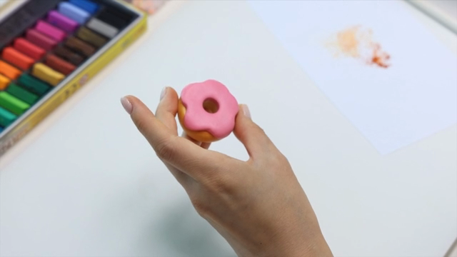 Hands crafting with colorful clay