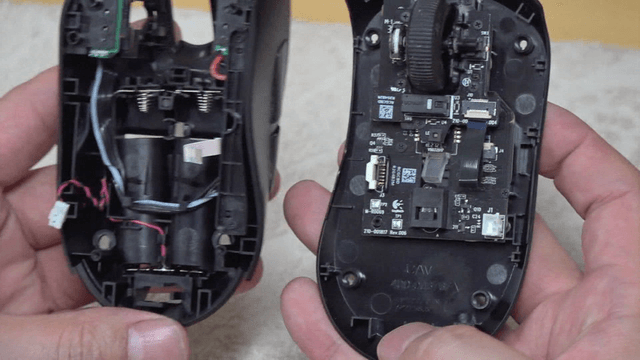 Disassembled computer mouse parts