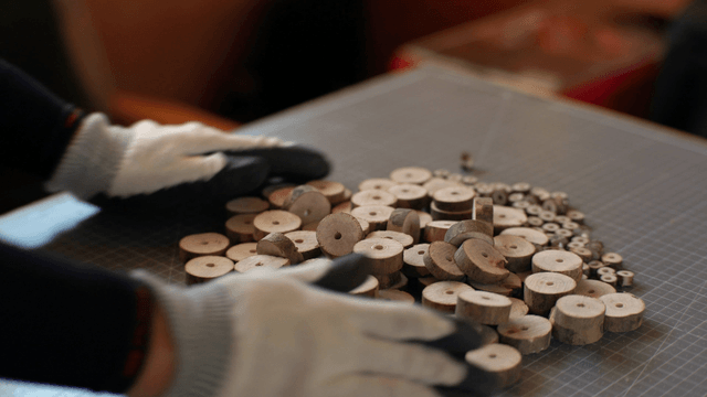 Wooden discs arranged on a cutting mat