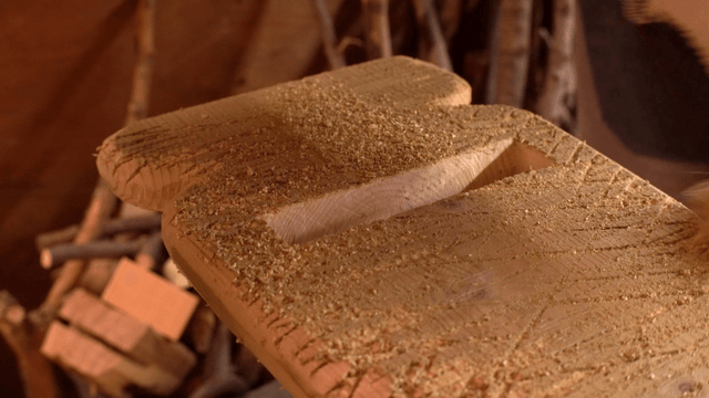 Wooden board covered in sawdust