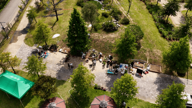 People gardening in a sunny park