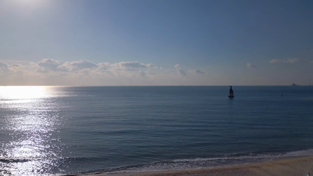 Serene beach with blue tents and calm sea