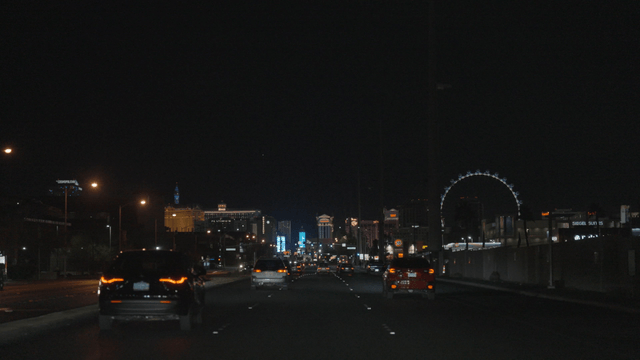 Night drive through a city with bright lights