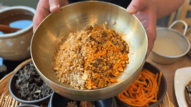 Spicy bibimbap served with various side dishes