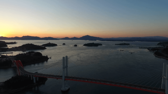 Sunset over a coastal bridge and islands