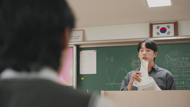 Teacher giving a lecture in a classroom