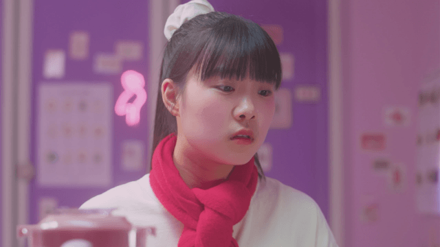 Embarrassed girl with red scarf