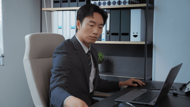 Businessman reviewing documents at desk