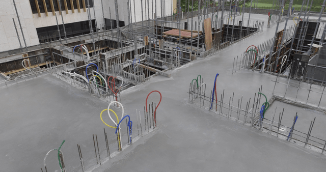 Concrete foundation with rebar and pipes