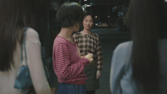 Group of women talking on a street
