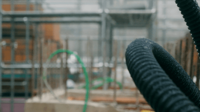 Construction site with metal pipes and scaffolding