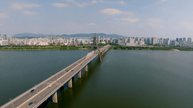 Cityscape with a wide bridge over the Han River